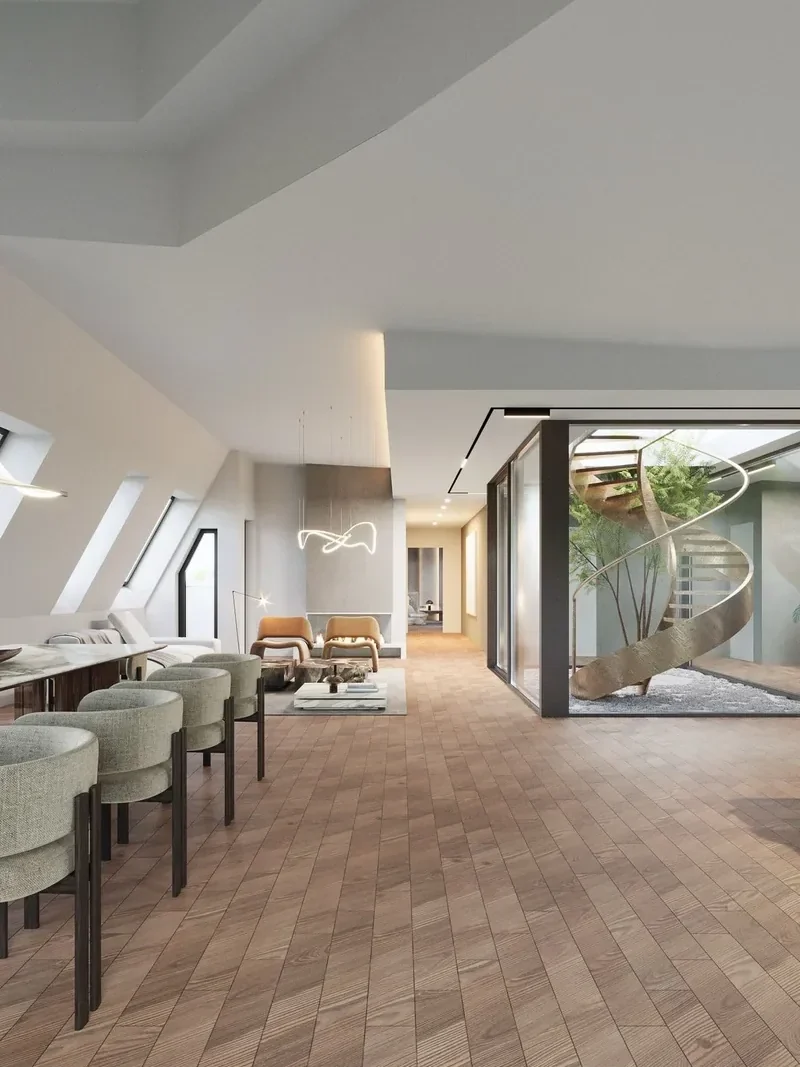 Ausgebauter Wohnraum mit Dachfenstern und Wendeltreppe